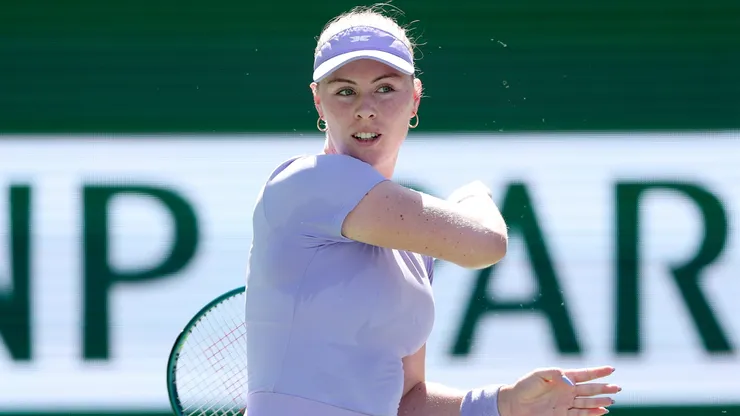 Talia Gibson returns a shot to Jasmine Paolini of Italy during Day 7 of the BNP Paribas Open.