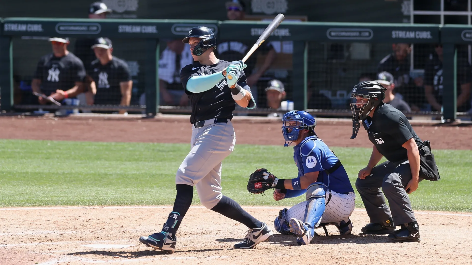 Aaron Judge #99 of the Yankees hits a single during the spring training game. Christian Petersen/Getty Images