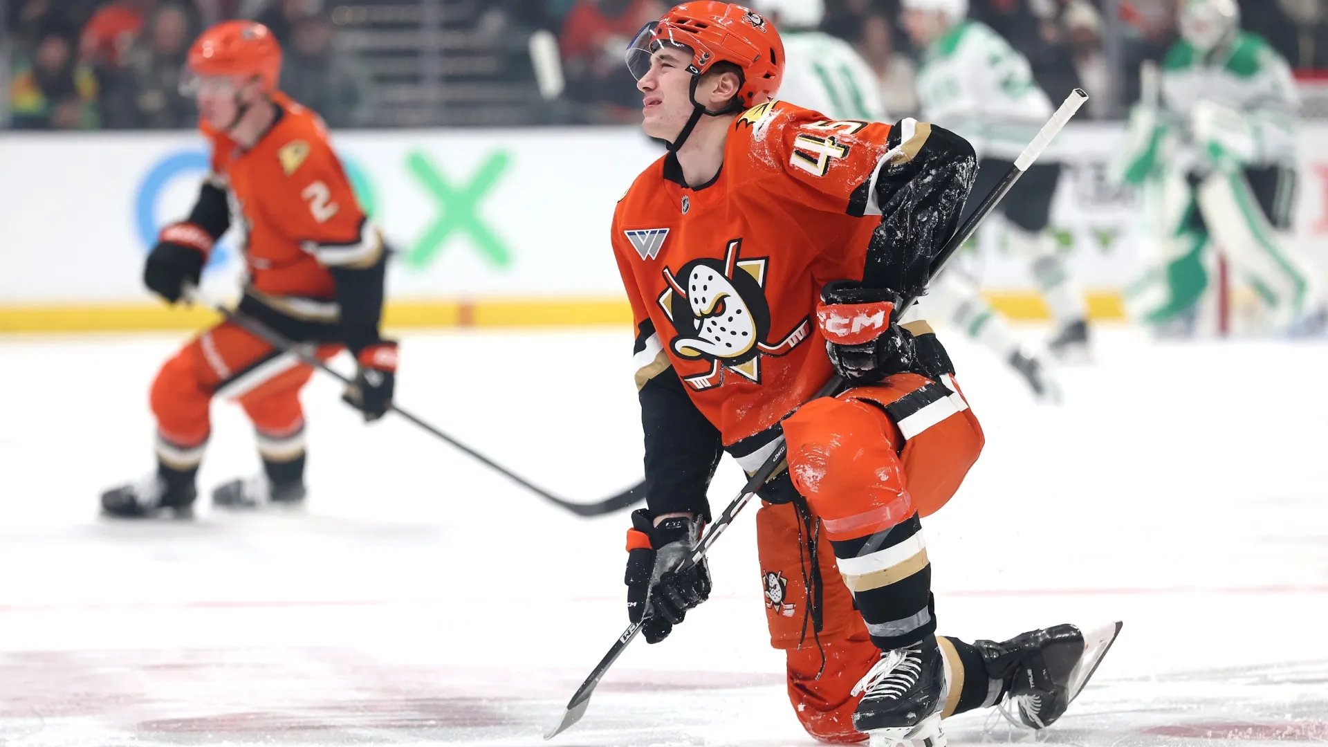 Beckett Sennecke #45 of the Ducks gets up slowly after a mid-ice hit. Sean M. Haffey/Getty Images
