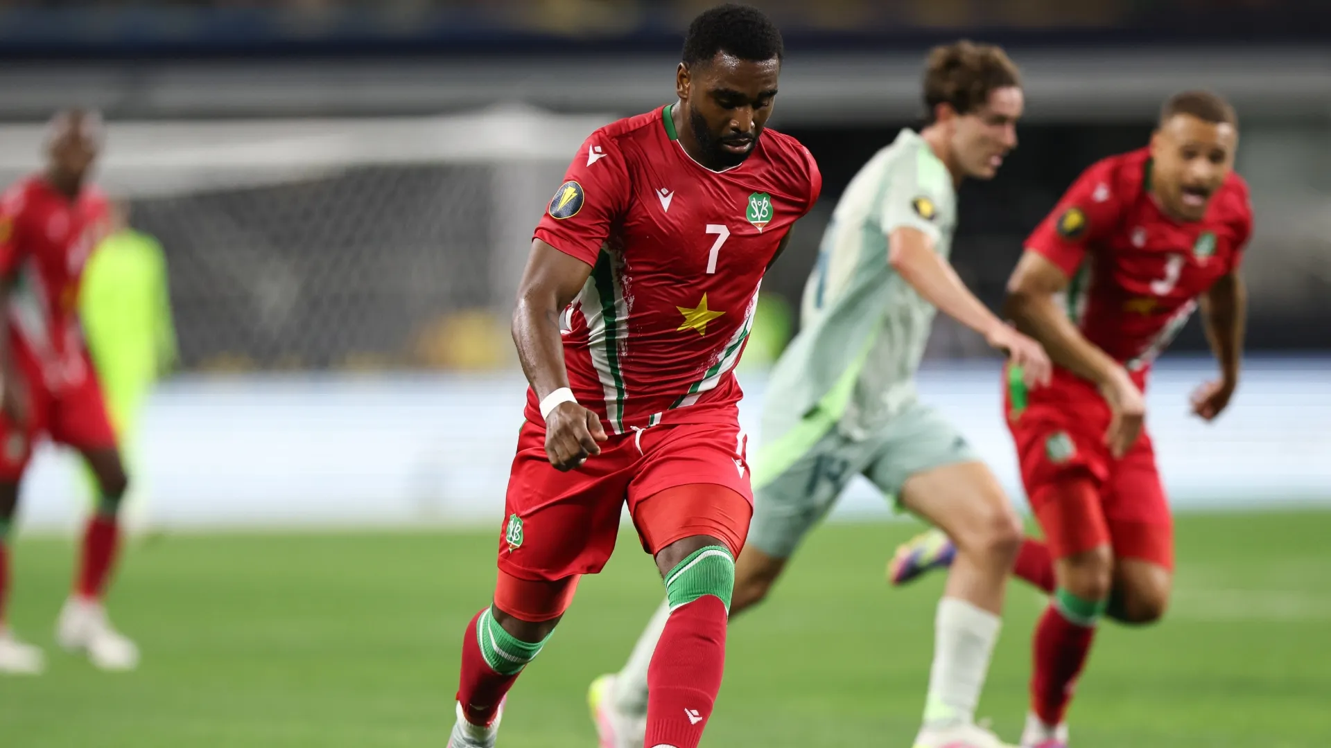 Gyrano Kerk #7 of Suriname drives the ball during the Group Stage – Group A match in 2025 (Source: Omar Vega/Getty Images)