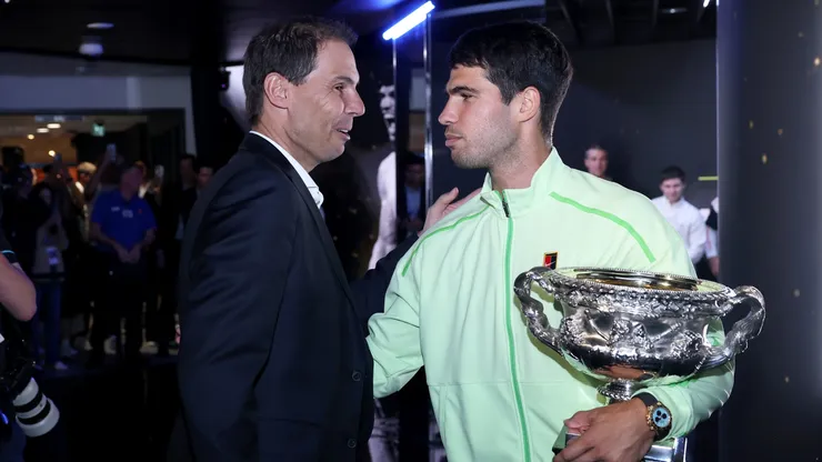 Carlos Alcaraz of Spain with Rafael Nadal and the Norman Brookes Challenge Cup.