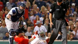 Gary Sanchez #24 of the Yankees comes to the aid of Kevin Plawecki #25 of the Red Sox in 2021.