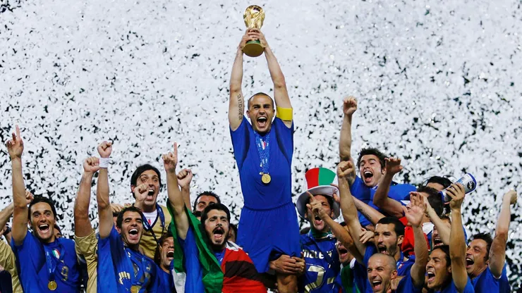 The Italian players celebrate as Fabio Cannavaro of Italy lifts the World Cup trophy in 2006.