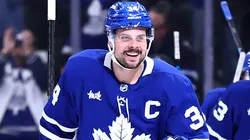 Auston Matthews #34 of the Maple Leafs celebrates his third goal of the game with teammates.