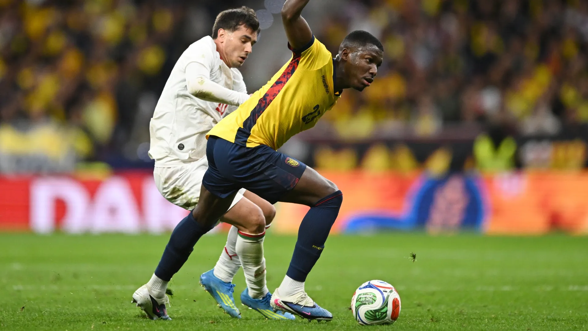 Brahim Diaz of Morocco battles for possession with Moises Caicedo of Ecuador