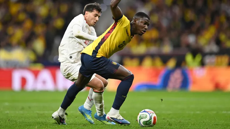 Brahim Diaz of Morocco battles for possession with Moises Caicedo of Ecuador
