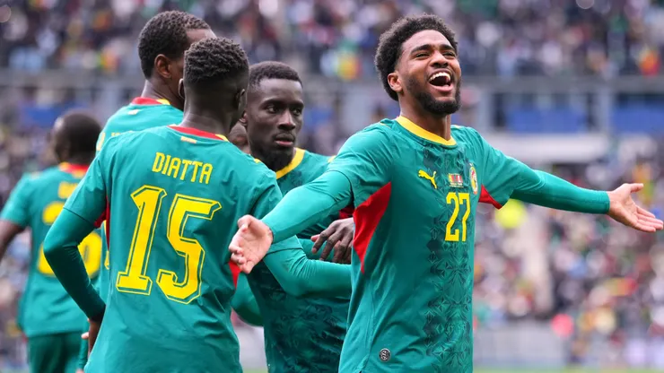 Ibrahim Mbaye of Senegal celebrates his team's first goal scored by teammate Nicolas Jackson.