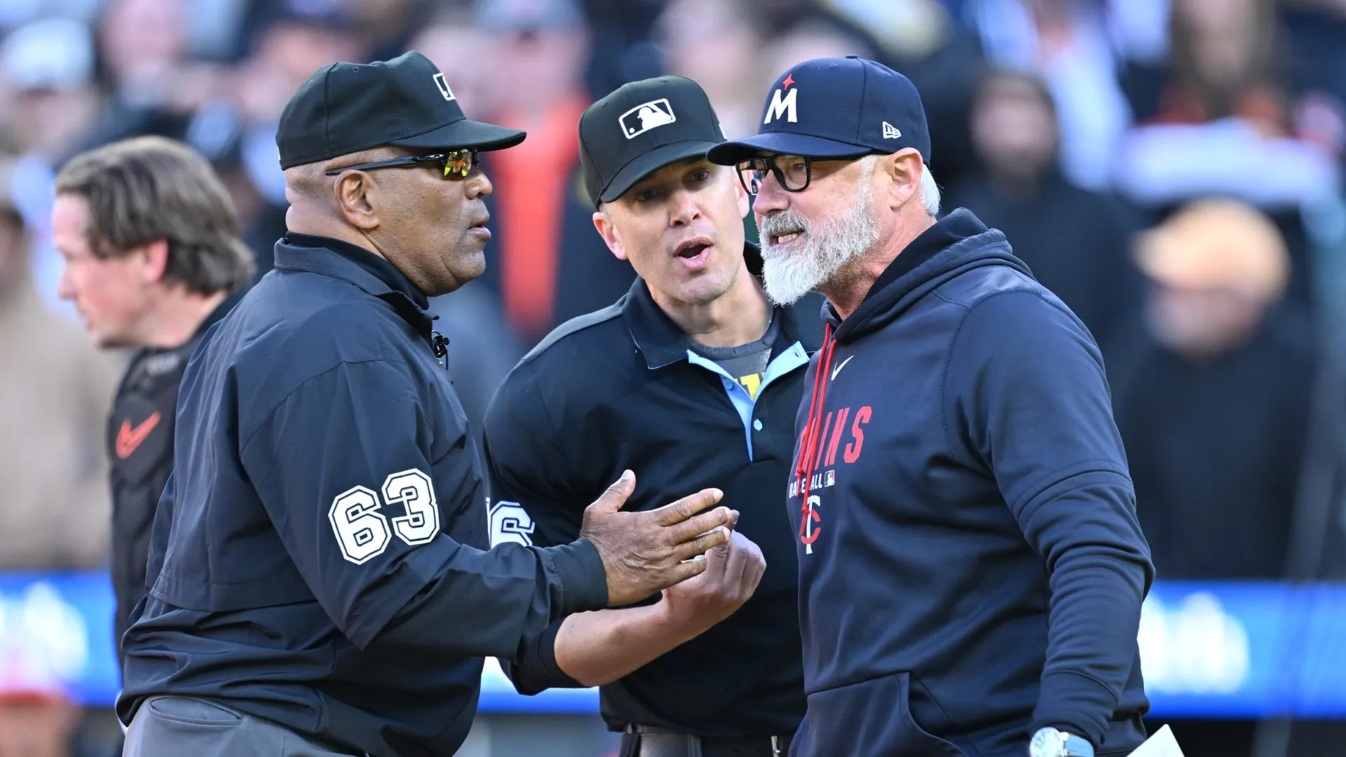 Derek Shelton discusses a call with umpires Laz Diaz (left) and Chris Segal (middle)
