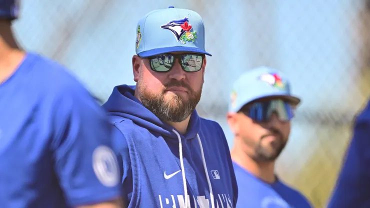 Manager John Schneider #14 of the Toronto Blue Jays looks on.