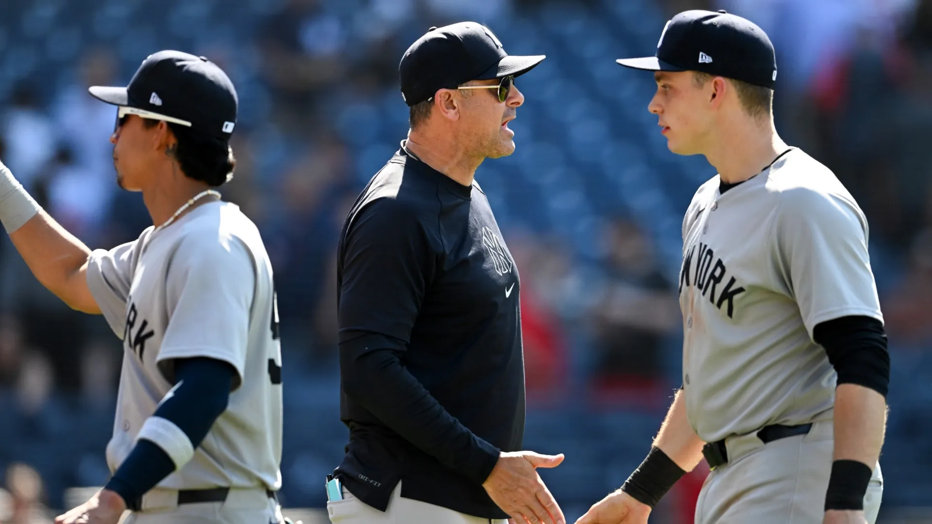 Aaron Boone #17 and Ben Rice #22 of the Yankees celebrate the team’s win. Nick Cammett/Getty Images