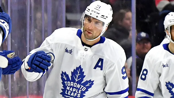 John Tavares #91 of the Maple Leafs celebrates with the bench.