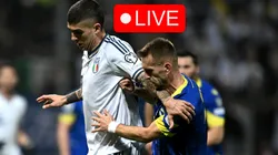 Amar Memic of Bosnia & Herzegovina competes for the ball with Gianluca Mancini of Italy.