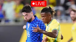 Danilo of Brazil and Martin Baturina of Croatia compete for the ball.