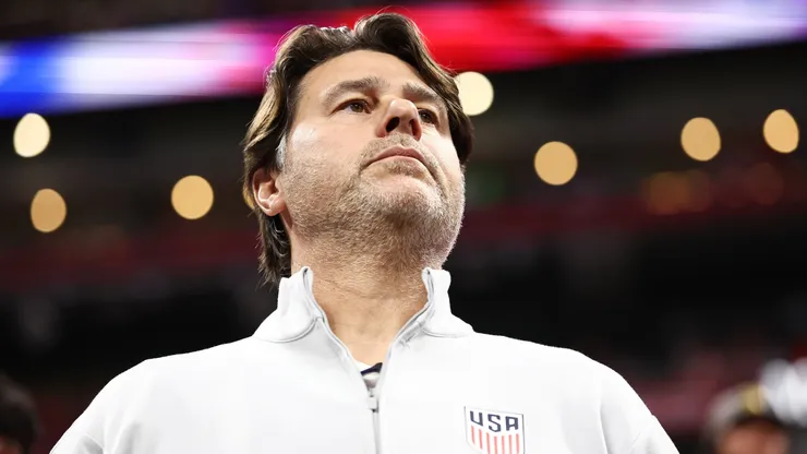 Mauricio Pochettino looks on.