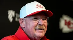 Andy Reid smiling at a press conference.