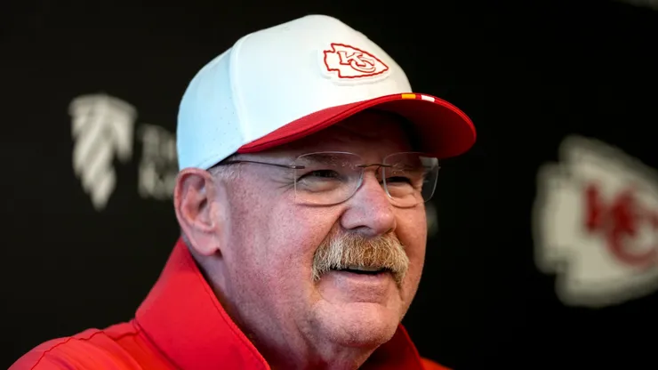 Andy Reid smiling at a press conference.