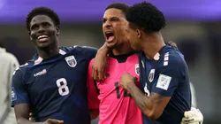 Joao Paulo Fernandes, Marcio Rosa and Kevin Pina of Cape Verde celebrate winning a game.
