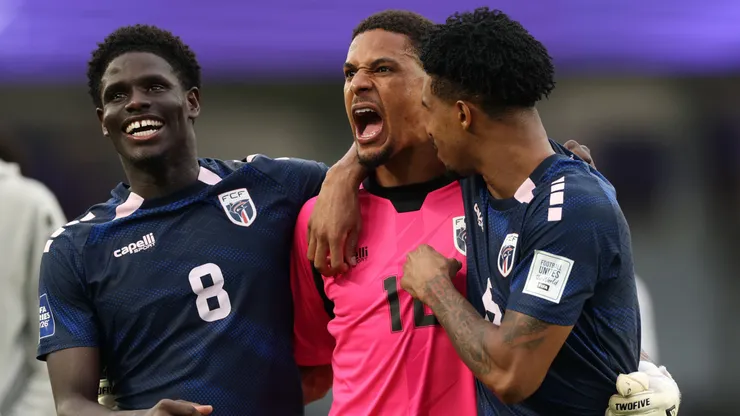 Joao Paulo Fernandes, Marcio Rosa and Kevin Pina of Cape Verde celebrate winning a game.