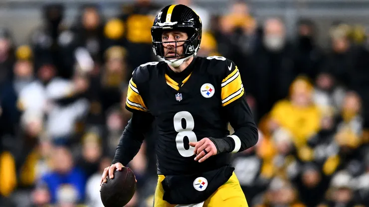 Aaron Rodgers scrambles in the fourth quarter of an NFL wild card playoff game in 2026.