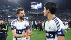 Thomas Muller (left) and Mathias Laborda celebrate after a Whitecaps win.