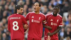 Virgil van Dijk of Liverpool lines up a wall with Dominik Szoboszlai and Ibrahima Konate