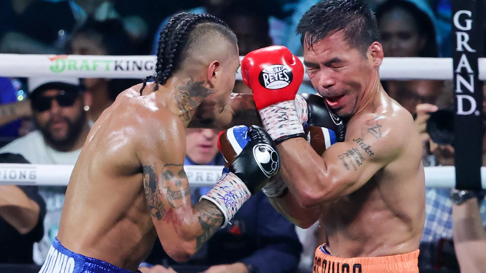 Mario Barrios (L) hits Manny Pacquiao in the 10th round of their WBC welterweight title fight. Ethan Miller/Getty Images
