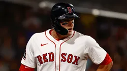 Roman Anthony #19 of the Boston Red Sox holds his lower back.