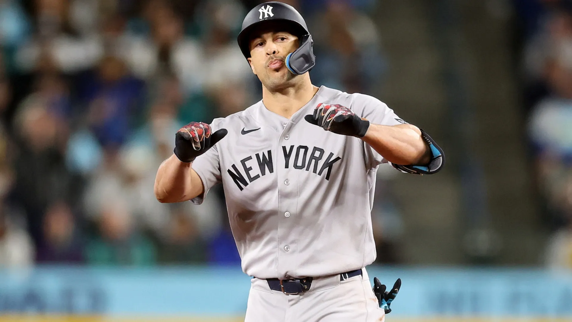 Giancarlo Stanton #27 of the New York Yankees celebrates his RBI double. Steph Chambers/Getty Images