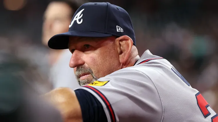 Manager Walt Weiss #22 of the Braves watches the action against the Diamondbacks.