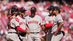 Alex Cora stands at the pitcher's mound with Red Sox players