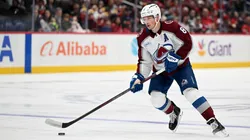 Cale Makar #8 of the Avalanche handles the puck against the Washington Capitals.
