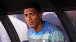 Jude Bellingham of Real Madrid looks on from the substitution bench.