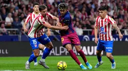 Lamine Yamal of Barcelona is challenged by Clement Lenglet of Atletico de Madrid in 2026.