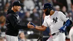 Amed Rosario #14 of the New York Yankees celebrates with manager Aaron Boone #17.