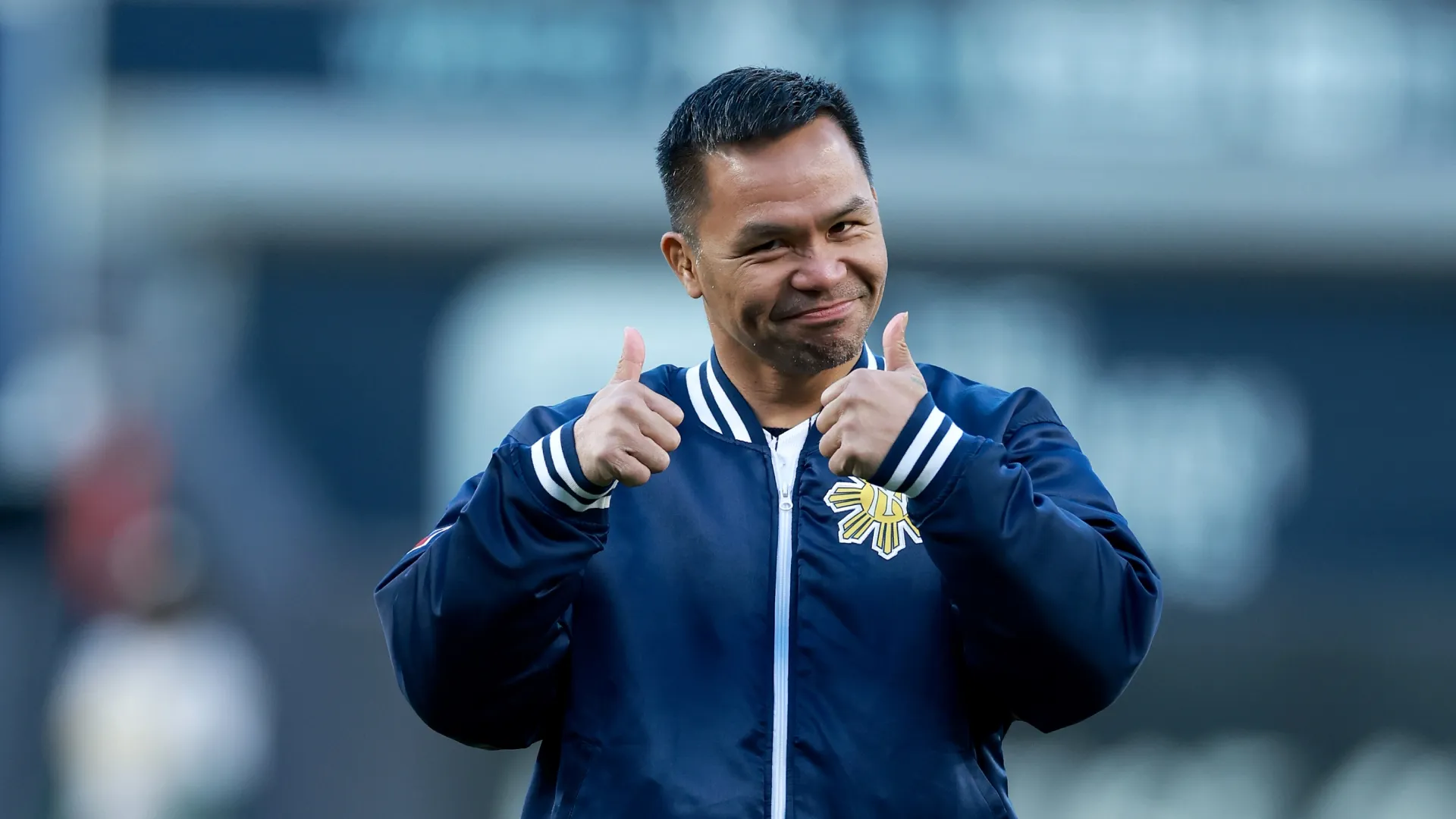 Manny Pacquiao reacts after throwing out the ceremonial first pitch at Yankee Stadium. Elsa/Getty Images