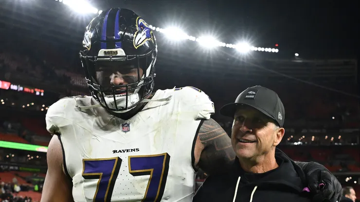 John Harbaugh and Daniel Faalele at Huntington Bank Field.