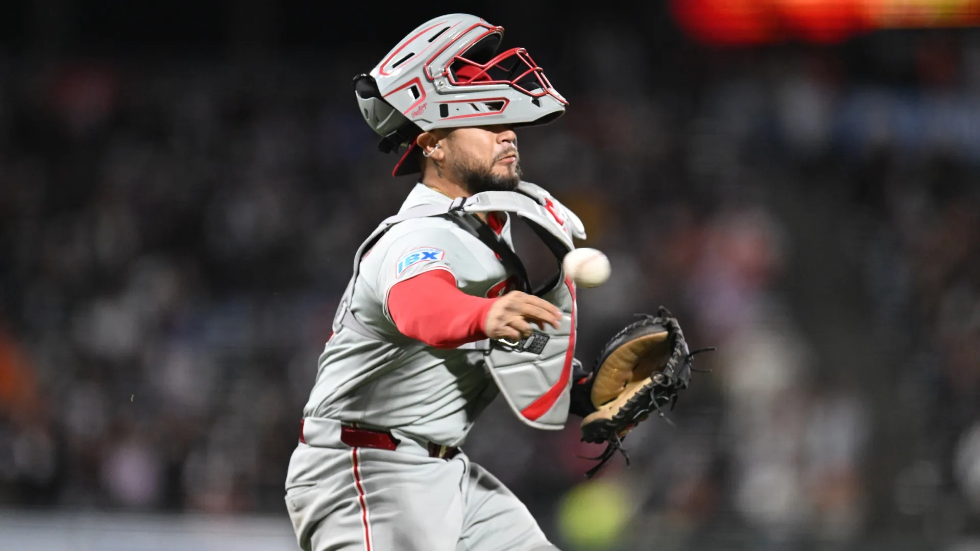 J.T. Realmuto #10 of the Phillies makes an error on a throw in the eighth inning at Oracle Park. Brandon Vallance/Getty Images