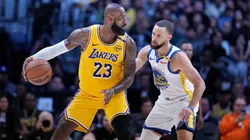 LeBron James #23 of the Lakers controls the ball against Stephen Curry #30 of the Warriors in 2025.