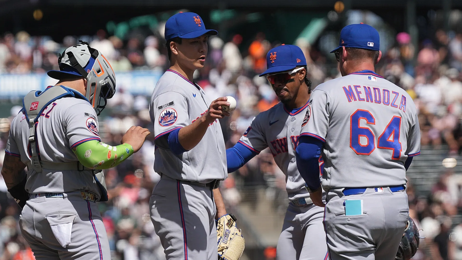 Manager Carlos Mendoza #64 of the Mets takes the ball from pitcher Kodai Senga. Thearon W. Henderson/Getty Images