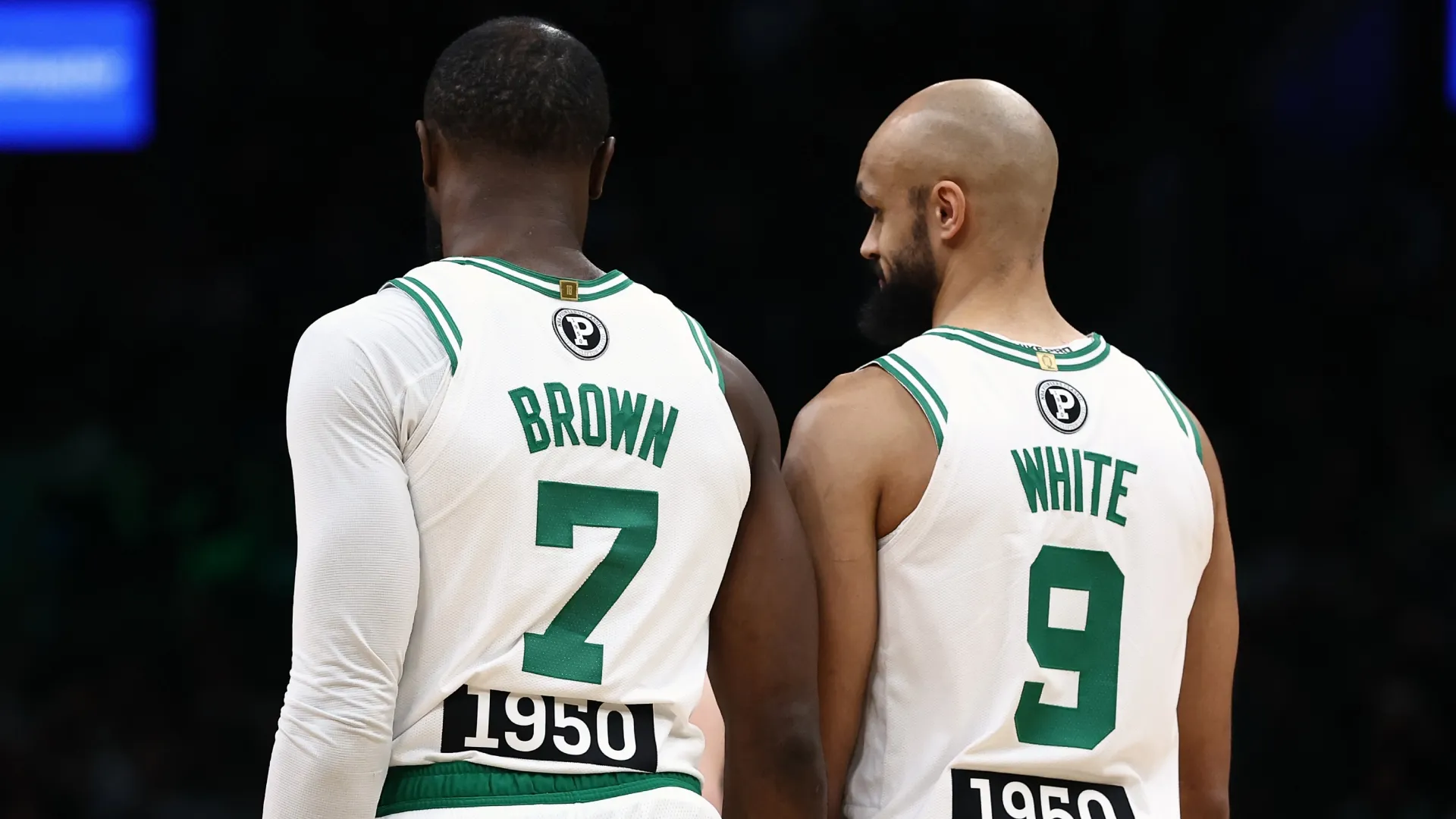 Jaylen Brown and Derrick White wearing jersey’s commerorating the inaugural NBA Pioneers Classic honoring the 75th anniversary of the NBA’s first black players (Source: Winslow Townson/Getty Images)