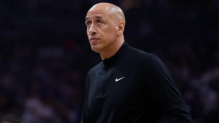 Head coach Doug Christie of the Sacramento Kings looks on.