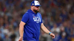 John Schneider #14 of the Toronto Blue Jays walks to the dugout.