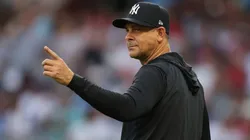 Manager Aaron Boone #17 of the New York Yankees points to the bullpen.