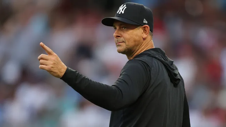 Manager Aaron Boone #17 of the New York Yankees points to the bullpen.