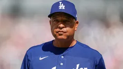 Dave Roberts #30 of the Los Angeles Dodgers looks on during the game.