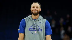 Stephen Curry of the Warriors smiles as he warms up before their game against the San Antonio Spurs.