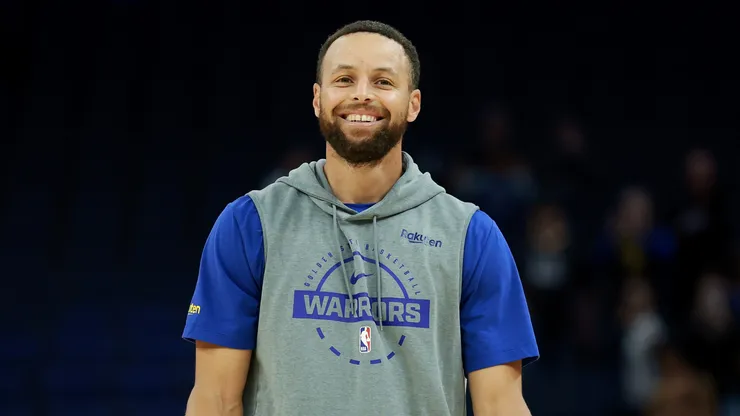Stephen Curry of the Warriors smiles as he warms up before their game against the San Antonio Spurs.