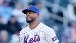 Freddy Peralta #51 of the New York Mets reacts after hitting a batter.