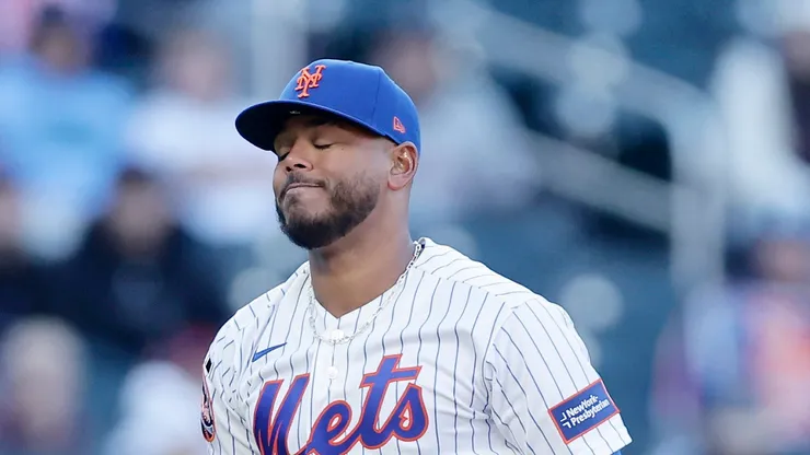 Freddy Peralta #51 of the New York Mets reacts after hitting a batter.