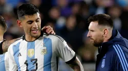 Cristian Romero and Lionel Messi of Argentina leave the field.